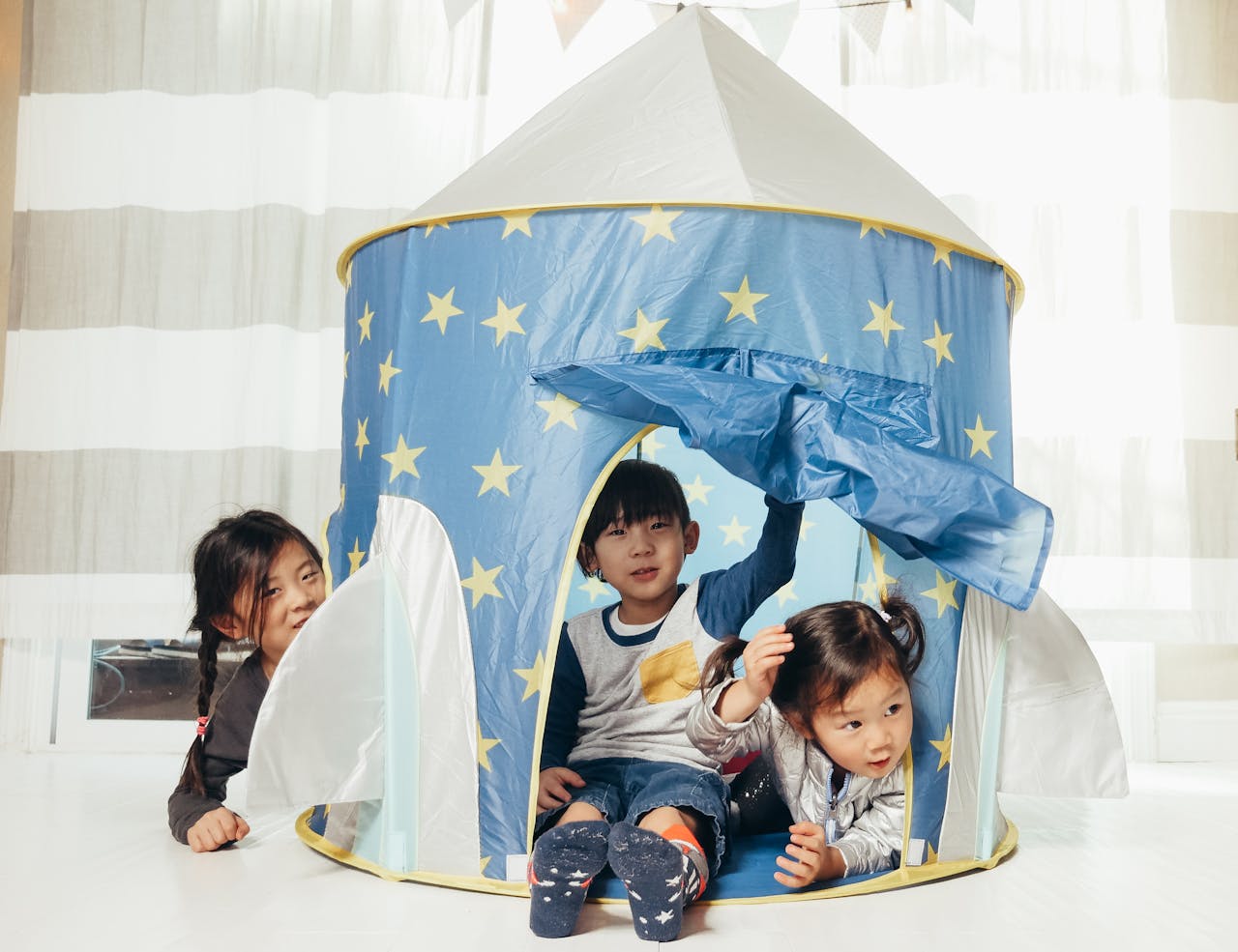 kids in tent - Build a Custom Outdoor Playhouse